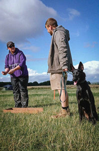 An instructor teaching a dog training class in Bristol